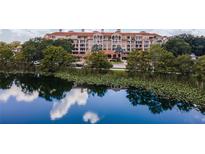 Beautiful lakefront condo building with lush landscaping and water views at 1110 W Ivanhoe Blvd # 5, Orlando, FL 32804