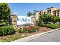 Siena at Bella Collina entrance sign, featuring a stone base and lush landscaping at 16300 County Road 455 # 305, Montverde, FL 34756