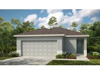 Charming one-story home featuring a two-car garage, neutral paint, and landscaped front yard at 338 Wayland Dr, Haines City, FL 33844