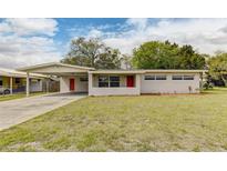 Charming single-story home with a well-maintained lawn and neutral-toned exterior at 812 Oleander St, New Smyrna Beach, FL 32168