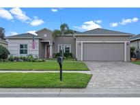 Charming one-story home with a well-manicured lawn and inviting curb appeal at 2107 Stone Cross Cir, Orlando, FL 32828