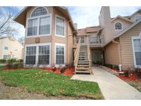 Inviting two-story condo with well-maintained landscaping and a charming entrance staircase at 634 Steamboat Ct # 171, Altamonte Springs, FL 32714