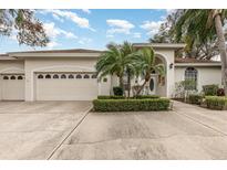 Charming single Gathering home featuring a 2-car garage and well-maintained landscaping at 6850 Huntington Hills Blvd, Lakeland, FL 33810