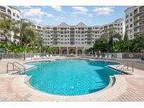 Take a dip in the sparkling blue pool surrounded by lush landscaping and a resort-style setting at 1 John Anderson Dr # 317, Ormond Beach, FL 32176