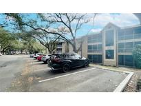 Exterior view of building showing parked cars and exterior architectural details at 629 Dory Ln # 202, Altamonte Springs, FL 32714