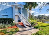 Charming condo exterior with a well-manicured lawn and beautiful landscaping at 2508 Grassy Point Dr # 106, Lake Mary, FL 32746