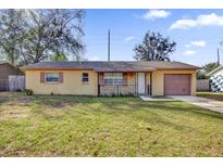 Charming single-story home featuring a front lawn and an attached one car garage at 1866 Matterhorn Dr, Orlando, FL 32818