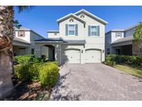 Charming two-story home featuring a two-car garage and a well-manicured front yard at 3270 Mt Vernon Way, Kissimmee, FL 34741