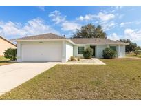 Charming single-story home with a two-car garage and well-maintained landscaping at 15204 Margaux Dr, Clermont, FL 34714