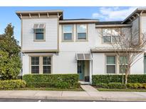 Charming two-story townhouse with well-maintained landscaping at 1547 Carey Palm Cir, Kissimmee, FL 34747