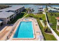 Lovely community pool and hot tub with dock access to the water at 2100 N Peninsula Ave # 1020, New Smyrna Beach, FL 32169