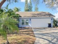 Charming single-story home with a two-car garage and well-maintained landscaping at 146 Brad Cir, Winter Haven, FL 33880
