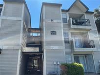 Condo building featuring multiple stories and balconies under a clear blue sky at 1932 Lake Atriums Cir # 85, Orlando, FL 32839