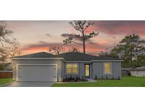Charming single-story home featuring a well-maintained lawn, attached garage, and neutral color palette at 4944 Tinkham Ave, Orlando, FL 32812