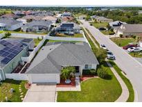 Beautiful single-story home featuring a well-manicured lawn and a two car garage in a desirable neighborhood at 133 Hillcrest Dr, Davenport, FL 33897