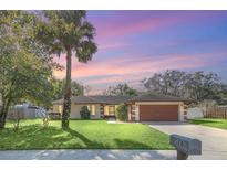 Charming single-story home featuring a well-manicured lawn and inviting curb appeal at 328 Bridle Path, Casselberry, FL 32707