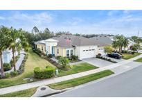 Inviting single-Gathering home showcasing manicured lawn and well-maintained landscaping at 1132 Fins Up Ct, Daytona Beach, FL 32124