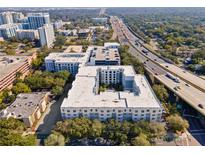 Stunning aerial view of the residential complex, showcasing its proximity to the highway and surrounding landscape at 206 E South St # 1030, Orlando, FL 32801