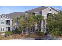 Well-maintained exterior showcasing the building's architecture and landscaping at 6542 Swissco Dr # 813, Orlando, FL 32822