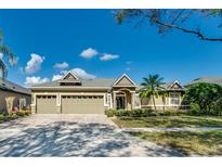 Charming single-story home with a three-car garage, landscaped yard, and inviting curb appeal at 824 Preserve Ter, Lake Mary, FL 32746