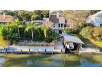 Stunning waterfront home featuring a private dock and boat lift, perfect for enjoying water activities at 124 Godfrey Rd, Edgewater, FL 32141