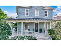 Inviting front porch with rocking chairs, providing a relaxing outdoor space at 4184 Oak St, Orlando, FL 32814