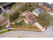 Beautiful aerial view of home with landscaped yard and view of pond with fountain in a well-kept neighborhood at 2753 Joseph Cir, Oviedo, FL 32765