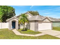 Charming one-story home with well-manicured lawn and attached two car garage at 1102 Brielle Ct, Oviedo, FL 32765