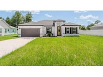 Beautiful, modern single Gathering home with well-maintained lawn and a two-car garage at 3324 Sw 137Th Loop, Ocala, FL 34473