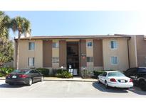A charming, multi-story condo building with designated parking and lush landscaping at 626 Orange Dr # 242, Altamonte Springs, FL 32701