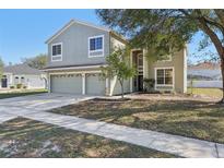 Charming two-story home featuring a two-car garage and a well-maintained front yard at 1368 Falconwood Ct, Apopka, FL 32712