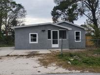 Charming home featuring a stucco exterior, well-maintained yard, and a welcoming entrance at 1303 37Th Nw St, Winter Haven, FL 33881