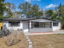 Charming single-story home features a freshly painted exterior, dark shutters, and an inviting front entrance at 1382 Wright St, Daytona Beach, FL 32117