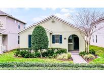 Charming single-story home with a well-manicured front yard and lush landscaping at 15506 Tidal Cove Aly, Winter Garden, FL 34787