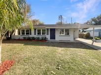 Charming single-story home with a well-manicured lawn and attached carport at 4270 Solomon Dr, Orlando, FL 32811