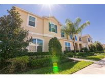 Charming two-story home featuring lush landscaping and a well-manicured front yard at 1507 Carey Palm Cir, Kissimmee, FL 34747