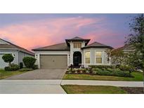 Charming single-story home with a well-manicured lawn and a welcoming two-car garage at 2116 Limestone Trl, Kissimmee, FL 34747