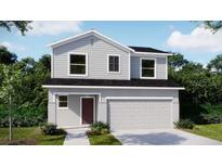 Charming two-story home with a two-car garage and a well-maintained front yard at 5563 Maddie Dr, Haines City, FL 33844