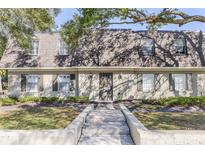 Charming townhouse with well-maintained front yard and neutral paint at 1913 Woodcrest Dr # B, Winter Park, FL 32792