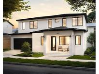 Stunning two-story modern home featuring a black roof, clean white stucco, and a welcoming front porch at 407 Calhoun Pl, Orlando, FL 32801