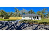 Charming single-story home boasts fresh exterior paint and a newly installed wooden fence, enhancing curb appeal at 1322 Maryland Ave, St Cloud, FL 34769