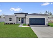 Beautiful one story home with a two car garage and landscaped yard at 166 Marion Oaks Ln, Ocala, FL 34473
