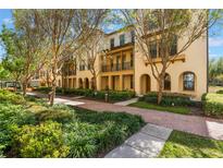 Charming townhouses with lush landscaping, brick pathways, and inviting curb appeal at 1859 Britlyn Aly, Orlando, FL 32814