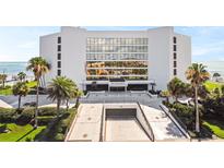 Modern condo building featuring covered parking and beach access at 901 S Atlantic Ave # 5, Ormond Beach, FL 32176