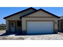 Charming single-Gathering home with a two-car garage and neutral color palette at 3225 Cup Dr, Lakeland, FL 33803