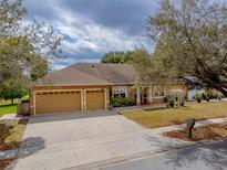 Charming single-story home with a three-car garage and a well-manicured front yard at 290 Thomas Dr, Casselberry, FL 32707