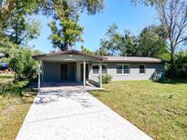 Charming single-story home with a covered entrance, long driveway and a well-maintained front yard at 815 Agnes Dr, Altamonte Springs, FL 32701
