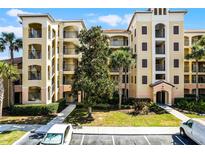 Beautiful condo complex featuring private balconies, manicured landscaping, and convenient parking at 8762 Worldquest Blvd # 6506, Orlando, FL 32821