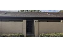 Townhome with private courtyard entrance and secure gate, offering privacy and curb appeal at 2284 Firestone Pl, Winter Haven, FL 33884