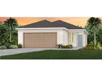 Charming single-story home featuring a two-car garage, neutral colors and lush landscaping at 3626 Cambridge Brook Dr, Davenport, FL 33837